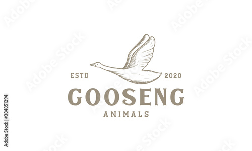 goose fly engraved vintage logo vector illustration design