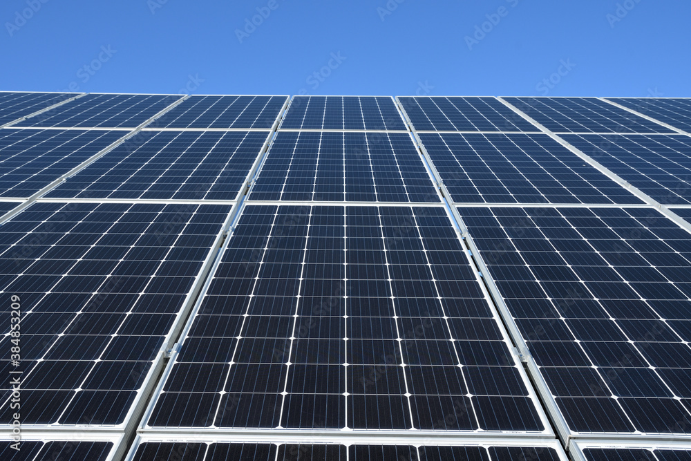 Solar panels against blue sky background.Against The Deep Blue Sky in suny weather Solar panels against blue sky background.Against The Deep Blue Sky in suny weather