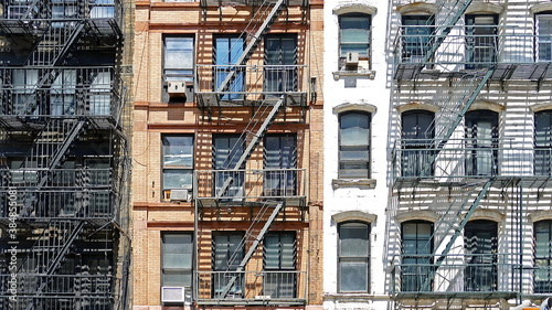 Typical fire escape by the colorful houses of Manhattan, New York City, USA