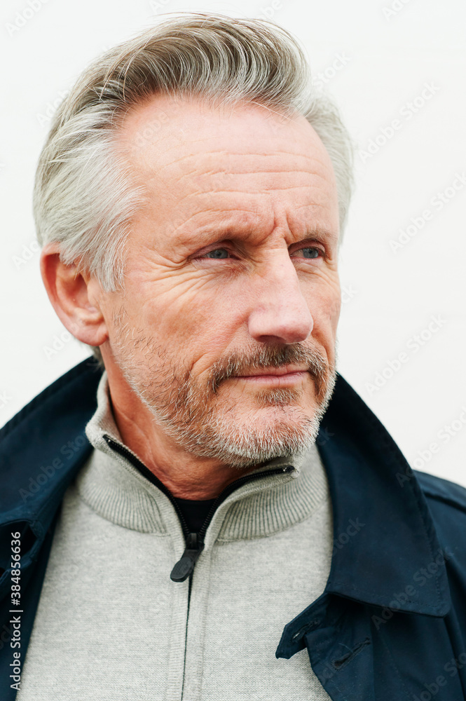 Mature man standing outside in the fall Mature man standing outside in the fall