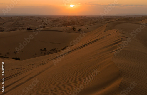 Riding the dunes at sunrise