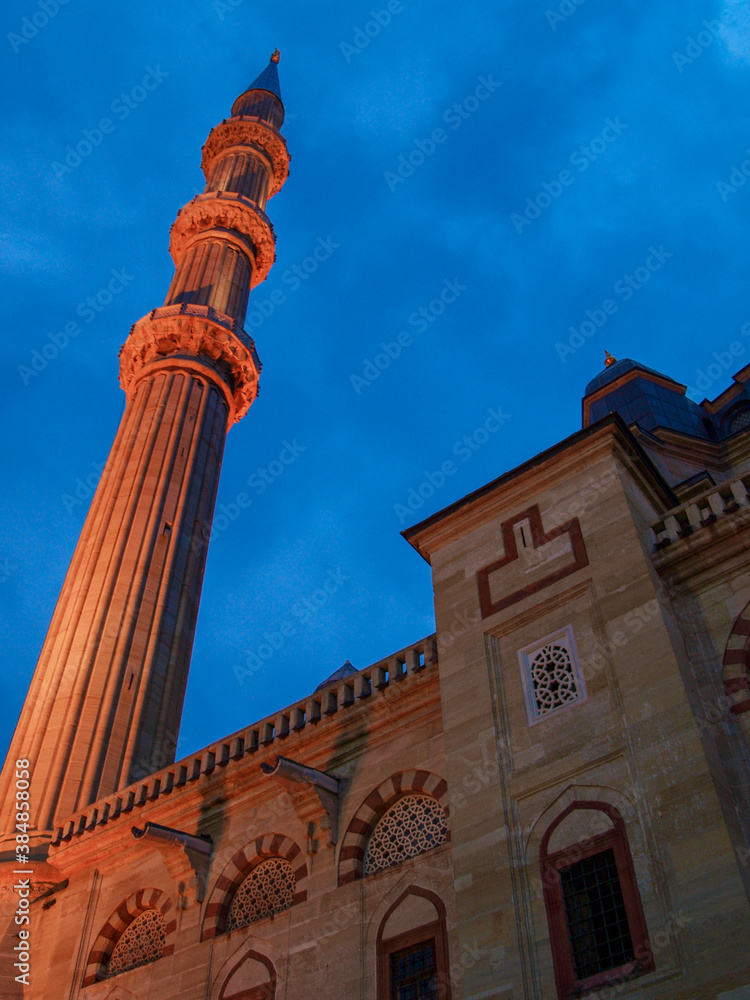 Selimiye Mosque is an Ottoman imperial mosque, the most famous historical monument of Edirne, located in the European part of Turkey. Dramatic minaret silhouette with blue sky sunset clouds.