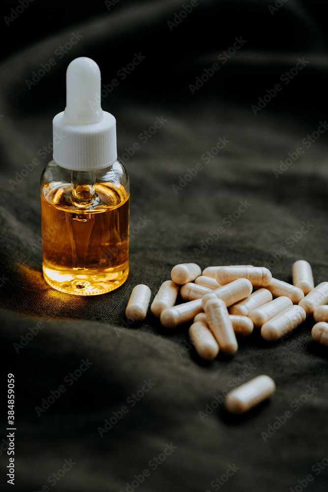 Essential Oil Bottle and nutritional pills Essential Oil Bottle and nutritional pills