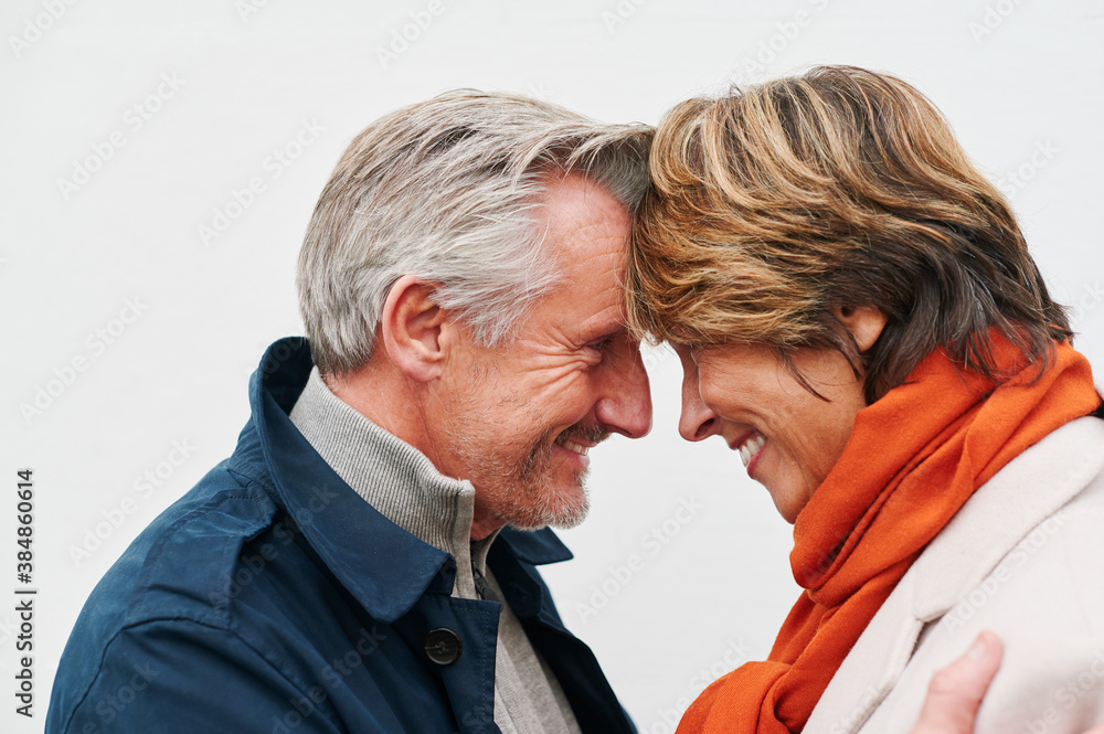 Smiling couple looking into each other's eyes Smiling couple looking into each other's eyes