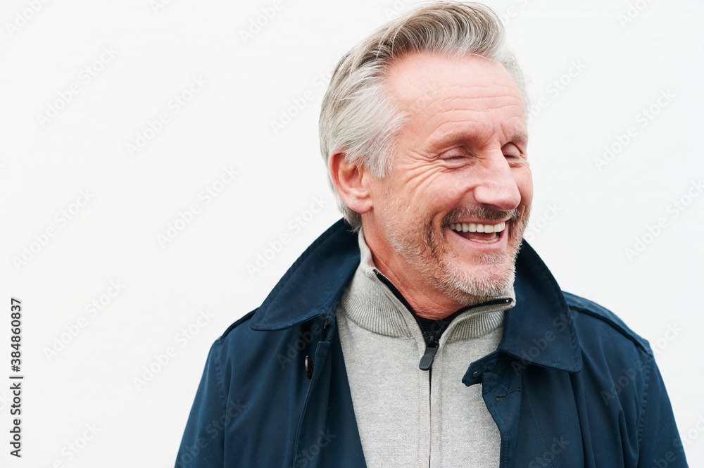 Laughing mature man smiling outdoors Laughing mature man smiling outdoors