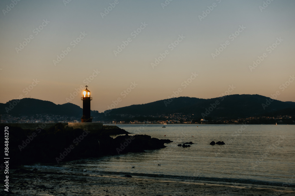 a lighthouse by the ocean a lighthouse by the ocean