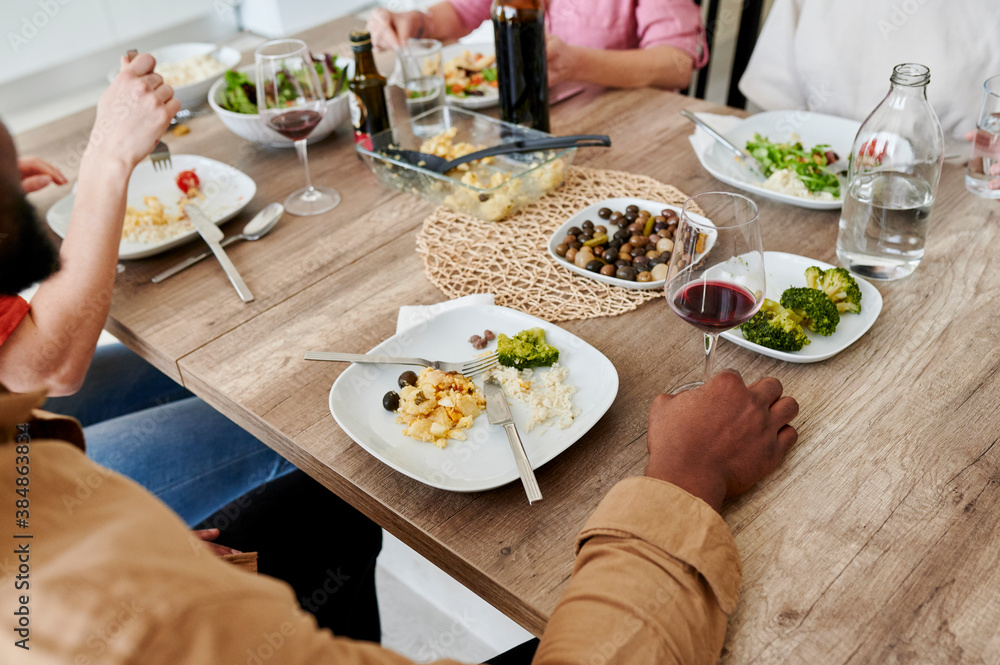 Diverse group of friends having dinner Diverse group of friends having dinner
