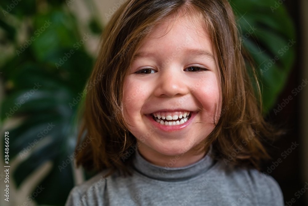 Delighted girl in turtleneck smiling Delighted girl in turtleneck smiling