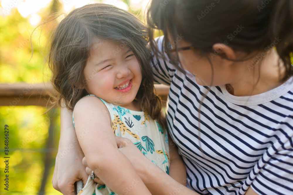 Happy child on mom's lap