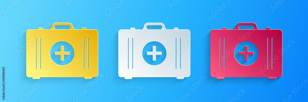 Obraz premium Paper cut First aid kit icon isolated on blue background. Medical box with cross. Medical equipment for emergency. Healthcare concept. Paper art style. Vector.