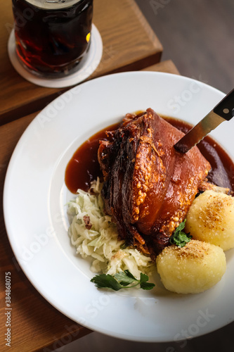German traditional pork knuckle with cabbage and potato 