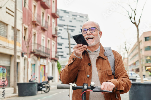 Senior man talking his on phone in the city