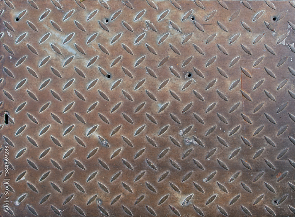 Old rusty metal surface with stamped ornament Old rusty metal surface with stamped ornament