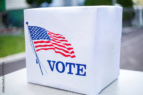 Konstfotografi Ballot box with american flag outside on sunny day.