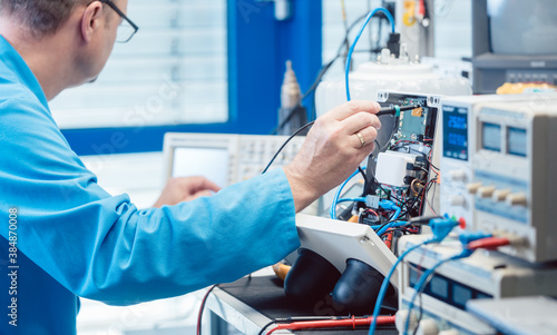 Photography Electronics engineer troubleshooting defects in a hardware product