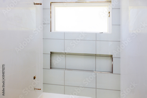 Renovation construction laying floor and wall tile reconstruction of bathroom