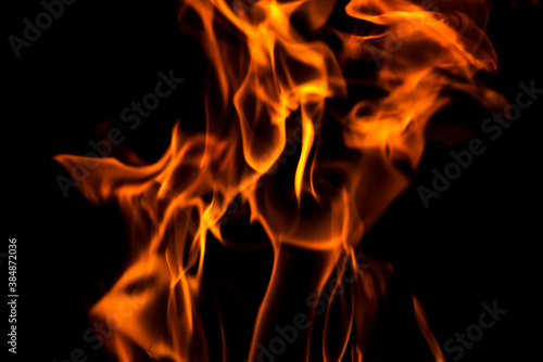 Fire flames abstract on black background. Fire and burning flame on dark background © spyrakot