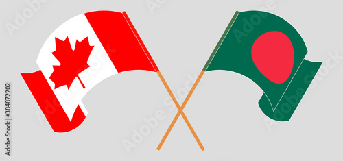 Crossed and waving flags of Bangladesh and Canada