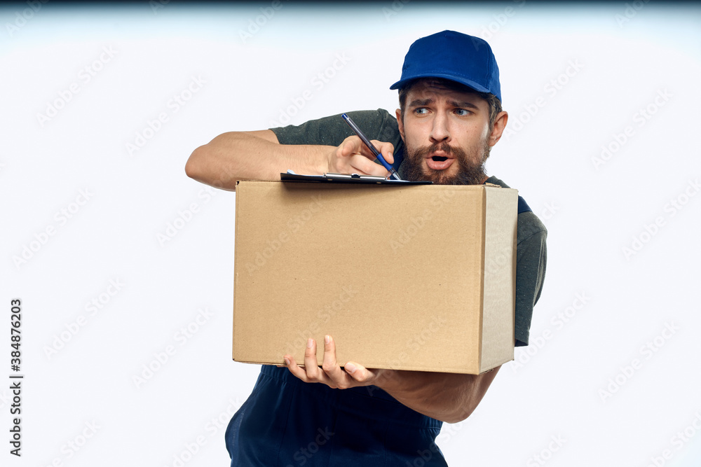 Working male courier with box in hand documents delivery service light background Working male courier with box in hand documents delivery service light background