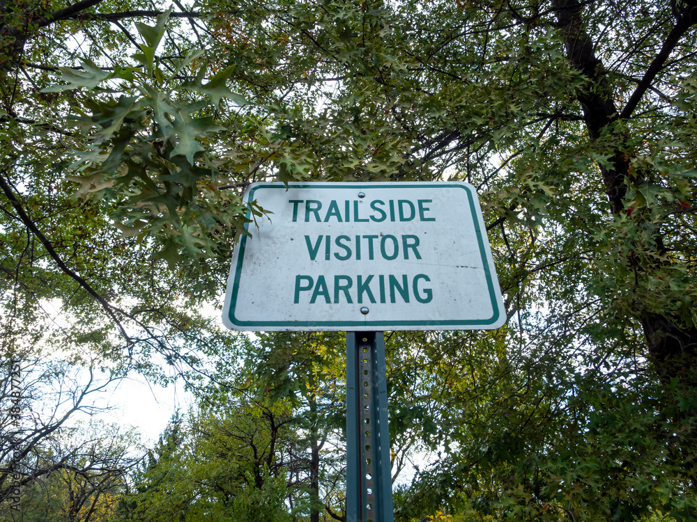 trailside visitor parking sign in the park