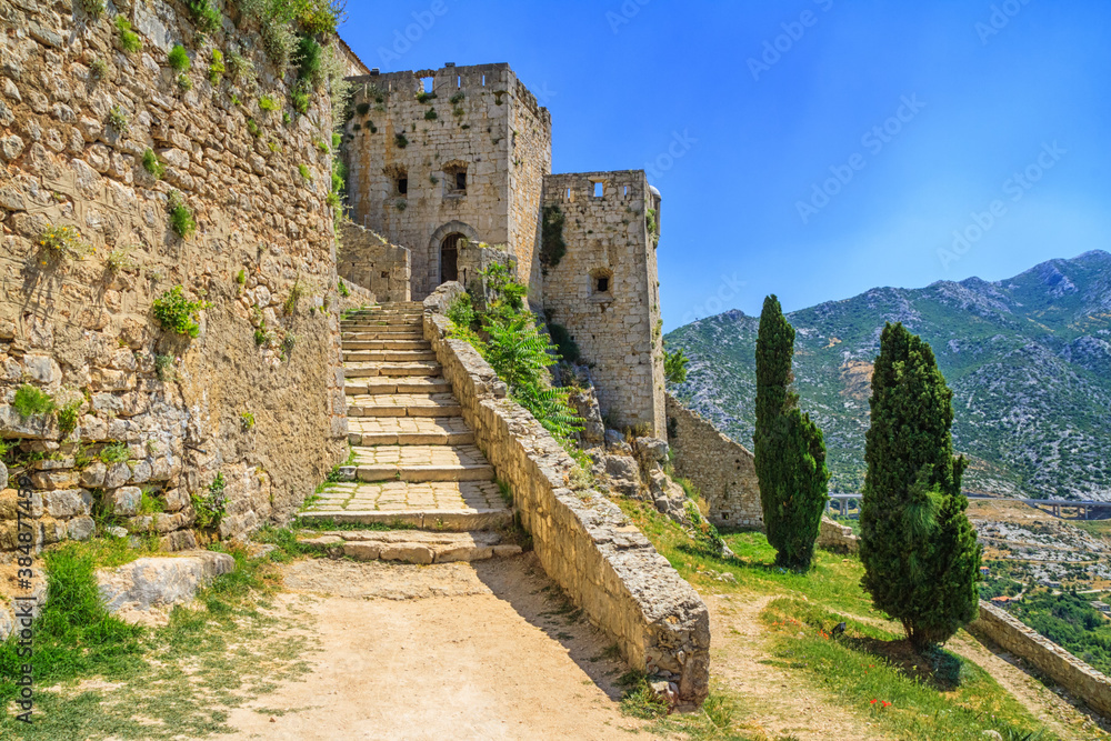 Summer mediterranean landscape - view of the stairs in the Klis Fortress, near Split on the Adriatic coast of Croatia
