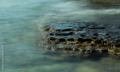 Seascape of Rocks Submerged in Water photo