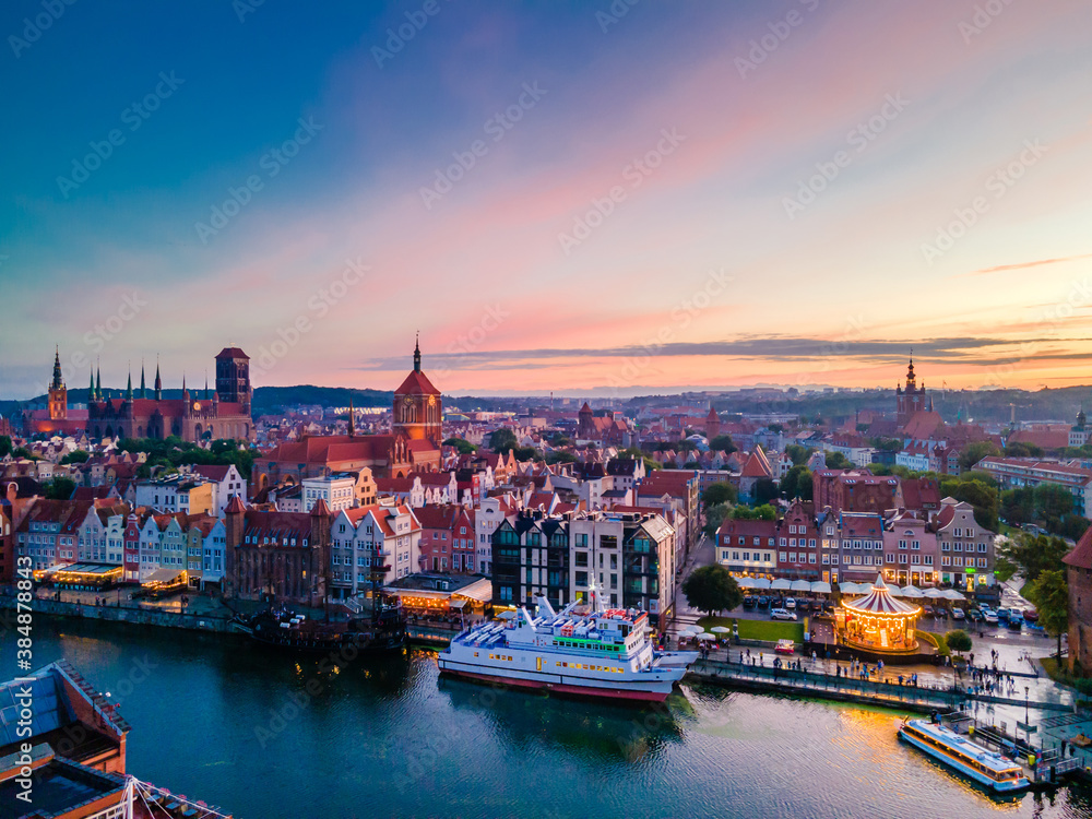Aerial sunset view of the amazing old town and rivers of Gdansk with ships