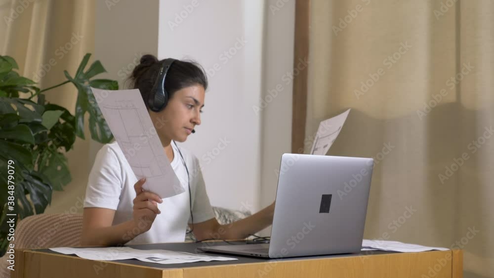 Smiling young indian woman video calling using laptop webcam conference at home. New Project Discussion Business Plan Bright Cozy Room At Home. Home Education Learning to know and Finance Smiling young indian woman video calling using laptop webcam conference at home. New Project Discussion Business Plan Bright Cozy Room At Home. Home Education Learning to know and Finance