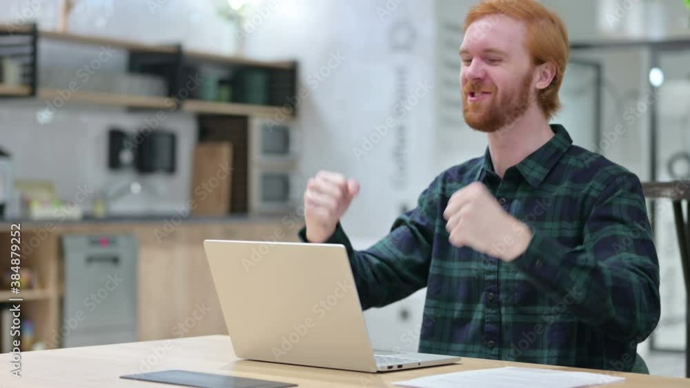 Excited Beard Redhead Man Celebrating Success on Laptop Excited Beard Redhead Man Celebrating Success on Laptop