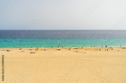 Uncrowded but once popular sandy beach. Morro Jable. Fuerteventura, Canary Islands. Spain. Summer 2020. Consequences of the Tourism Industry Crisis Due to COVID-19. © Sergey Kohl