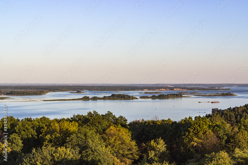 Summer background with a view of the river and the vast expanses of greenery.