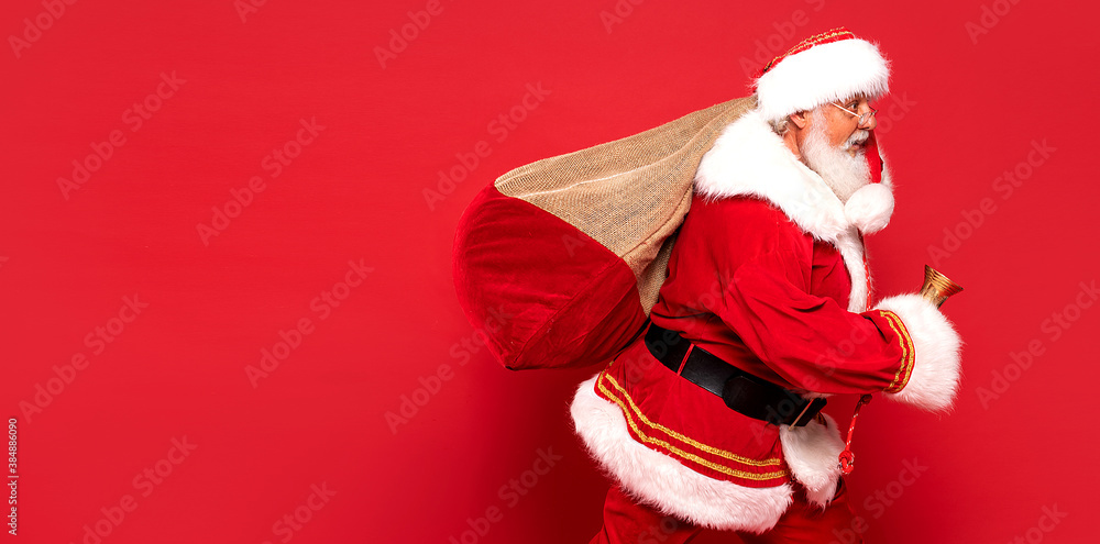 Funny Santa Claus holding sack bag with Merry Christmas presents. Funny Santa Claus holding sack bag with Merry Christmas presents.