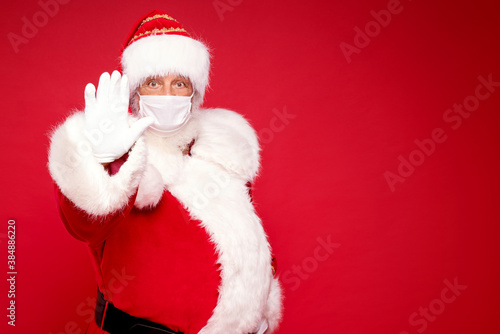 Real Santa Claus in white mask posing