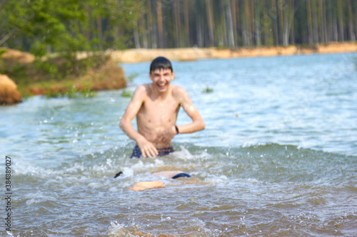 Fototapeta Naklejka Na Ścianę i Meble -  splashing water in the lake in nature entertainment