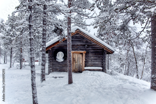 cabin in the snowy forest of finland