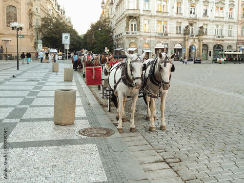 Prague, Czech Republic - September 27, 2020:horse-drawn carriage, Old Town Square markets, restaurants, People crowded at the Old Town Square in Prague photo