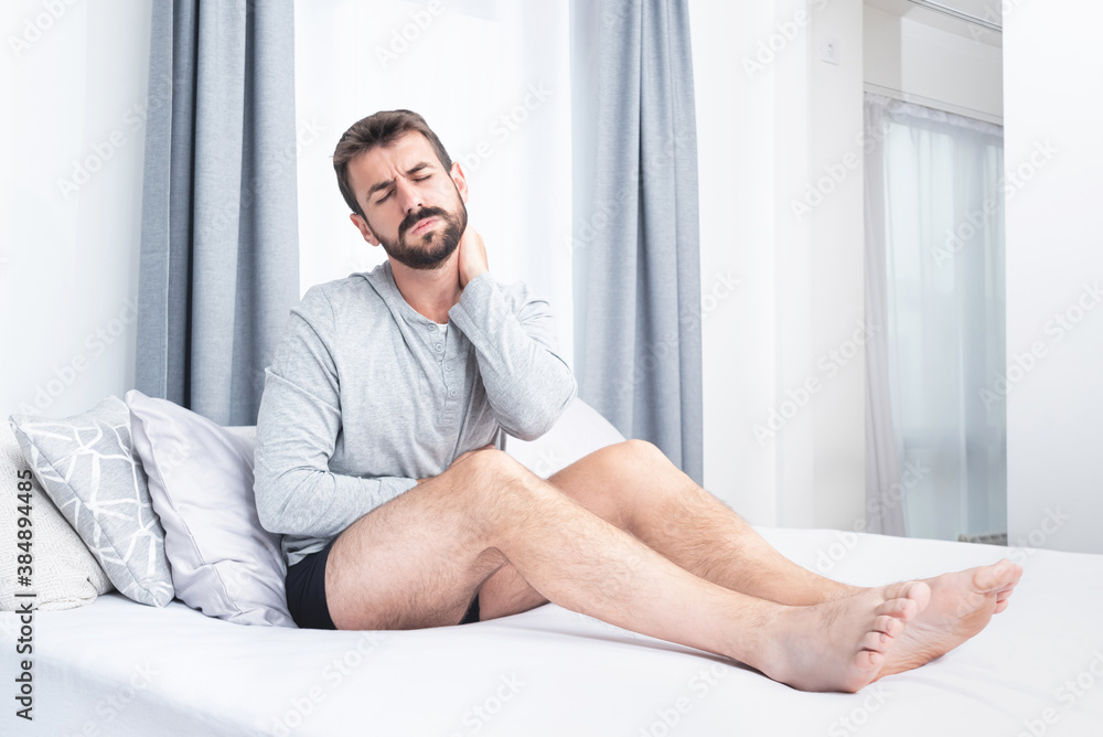 Man suffering with stomach and neck pain Man suffering with stomach and neck pain