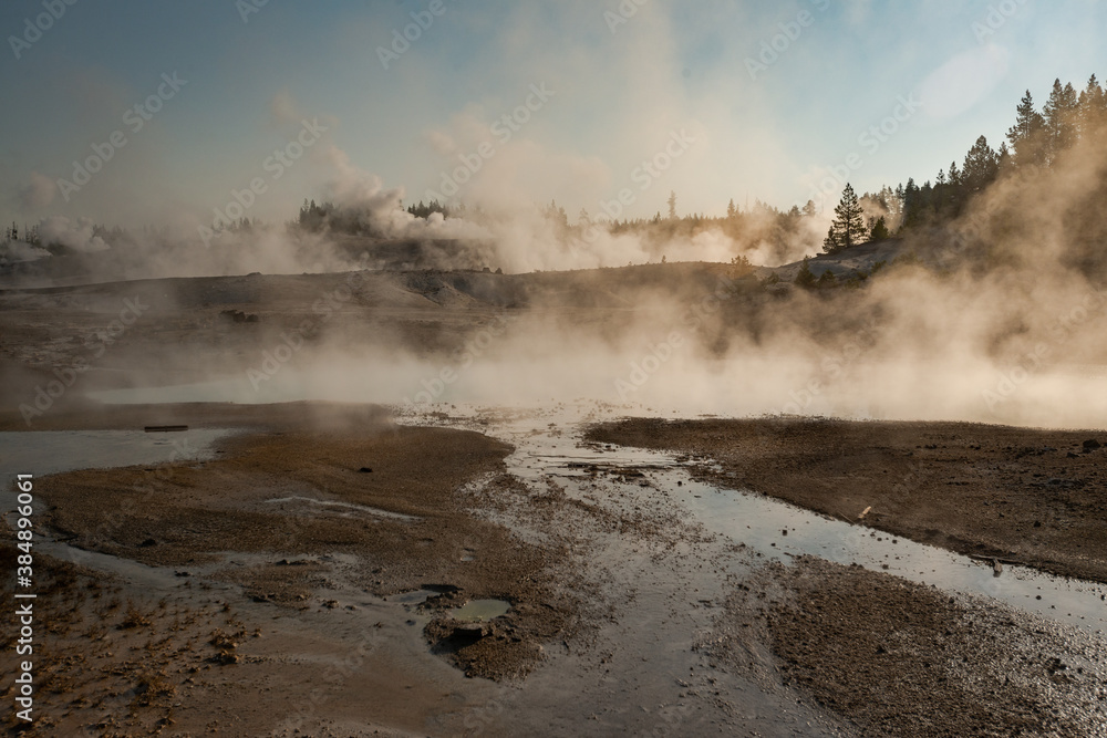 Hot Springs and gushing Geysers at Yellowstone National Park wilderness area atop a volcanic hot spot. USA.