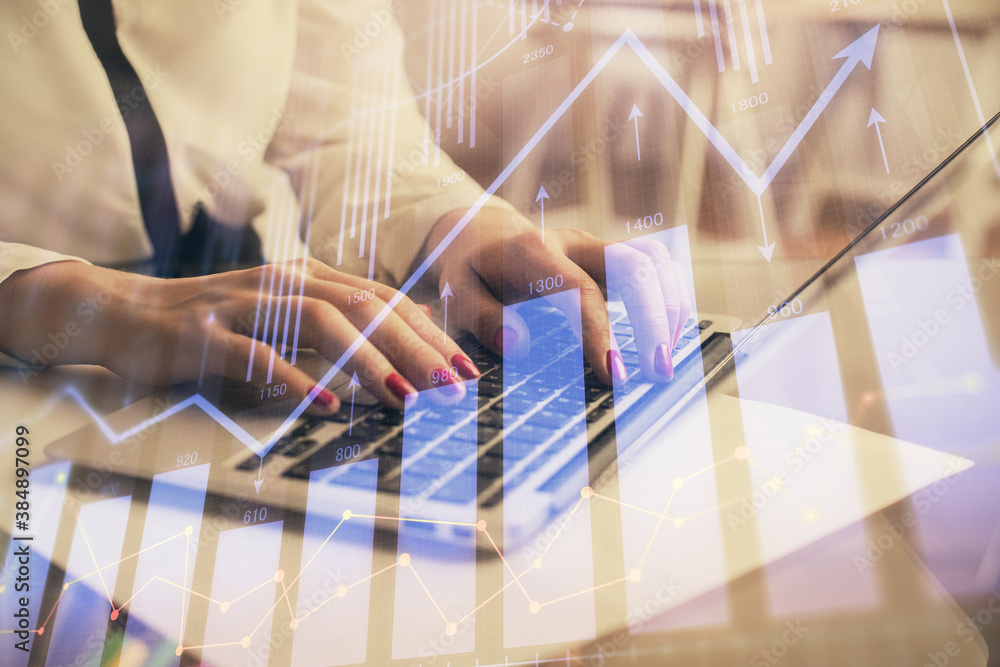Multi exposure of woman hands typing on computer and financial graph hologram drawing. Stock market analysis concept. Multi exposure of woman hands typing on computer and financial graph hologram drawing. Stock market analysis concept.
