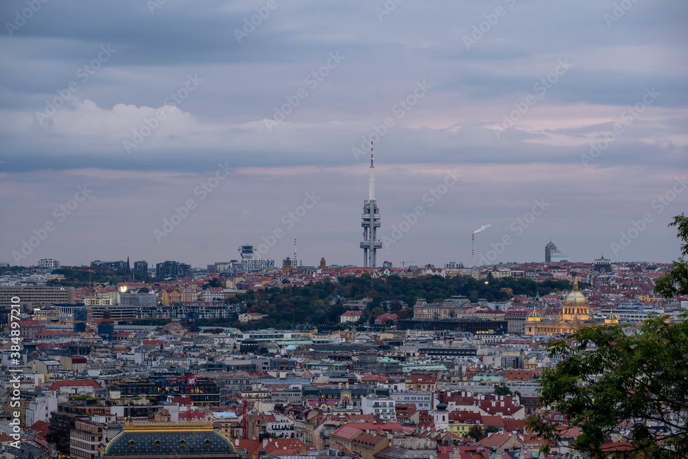 
panoramic view of Prague and roofs of Prague buildings at sunset in the Czech Republic