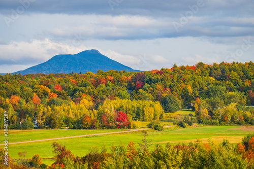 Canvas Print view of rural farm fields and forests  with Camels Hump Mountain in fall foliage