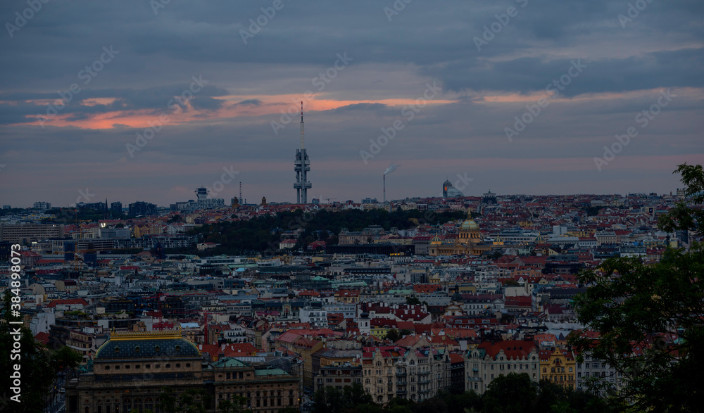 
panoramic view of Prague and roofs of Prague buildings at sunset in the Czech Republic