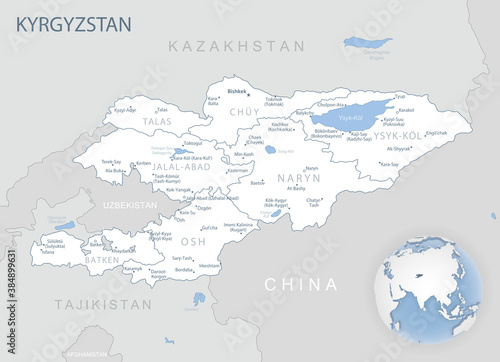 Blue-gray detailed map of Kyrgyzstan administrative divisions and location on the globe.