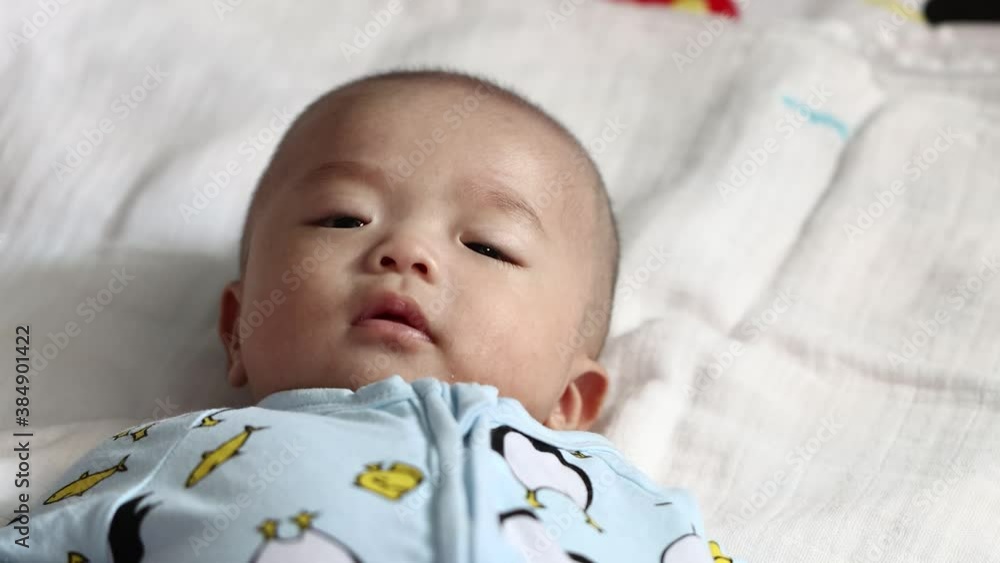 Lovely asian baby wakeup and smile after wakeup. Healthy Adorable Infant Laughing. Lovely asian baby wakeup and smile after wakeup. Healthy Adorable Infant Laughing.