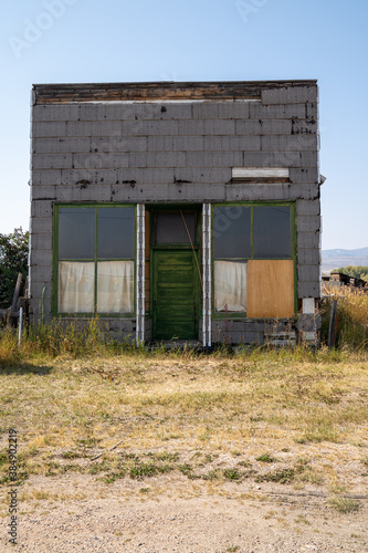 Old abandoned building in rural Ovid, Idaho on a sunny day