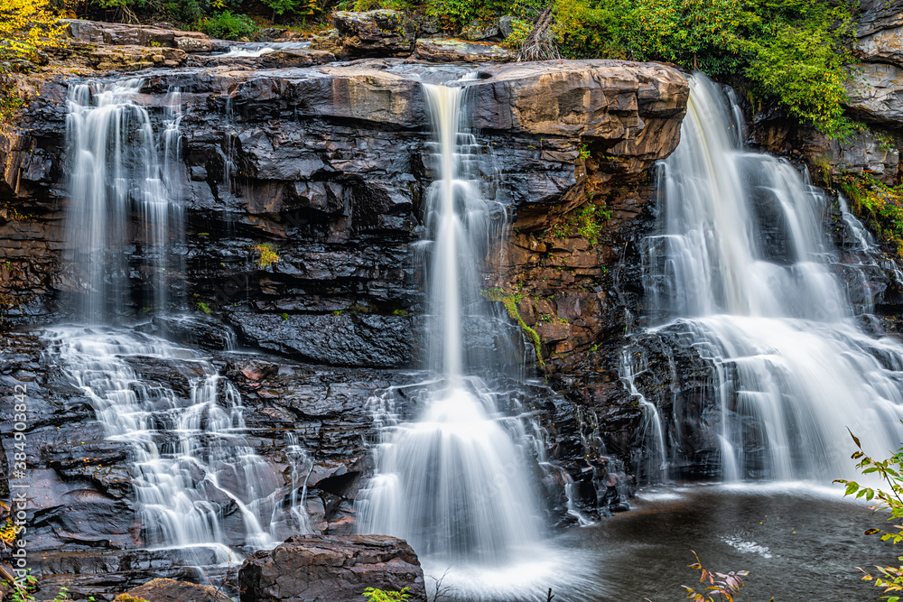 Fototapeta premium Blackwater Falls famous waterfall closeup in State Park in West Virginia during autumn fall season with long exposure of water
