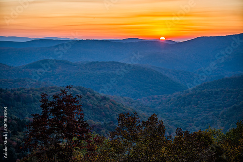 2020 Fall autumn season foliage with sunrise morning at Highland Scenic highway 150 road in West Virginia Monongahela National Forest Appalachian Mountains colorful sun