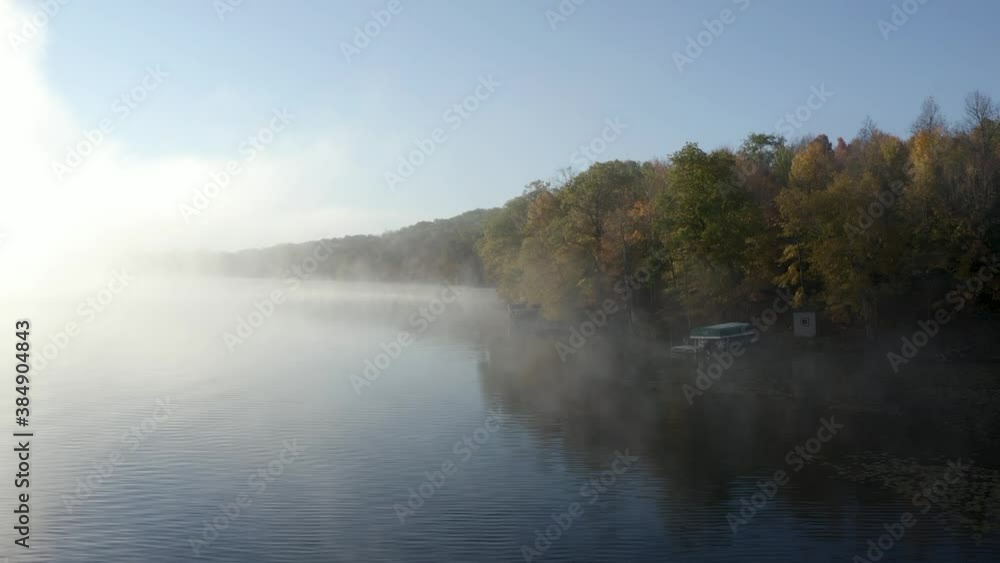 Morning mist rises on a lake in northern Wisconsin as peak fall colors show their beauty. Morning mist rises on a lake in northern Wisconsin as peak fall colors show their beauty.