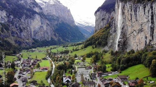 Aerial view over the village of Lauterbrunnen in Switzerlandwith its famous waterfall - drone footage photo