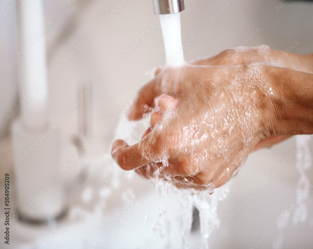 Washing hands under the water tap or faucet without soap. Hygiene concept detail. Beautiful hand and water stream in bathroom. New modern basin cleaning.
Washing hands under the water tap or faucet without soap. Hygiene concept detail. Beautiful hand and water stream in bathroom. New modern basin cleaning.